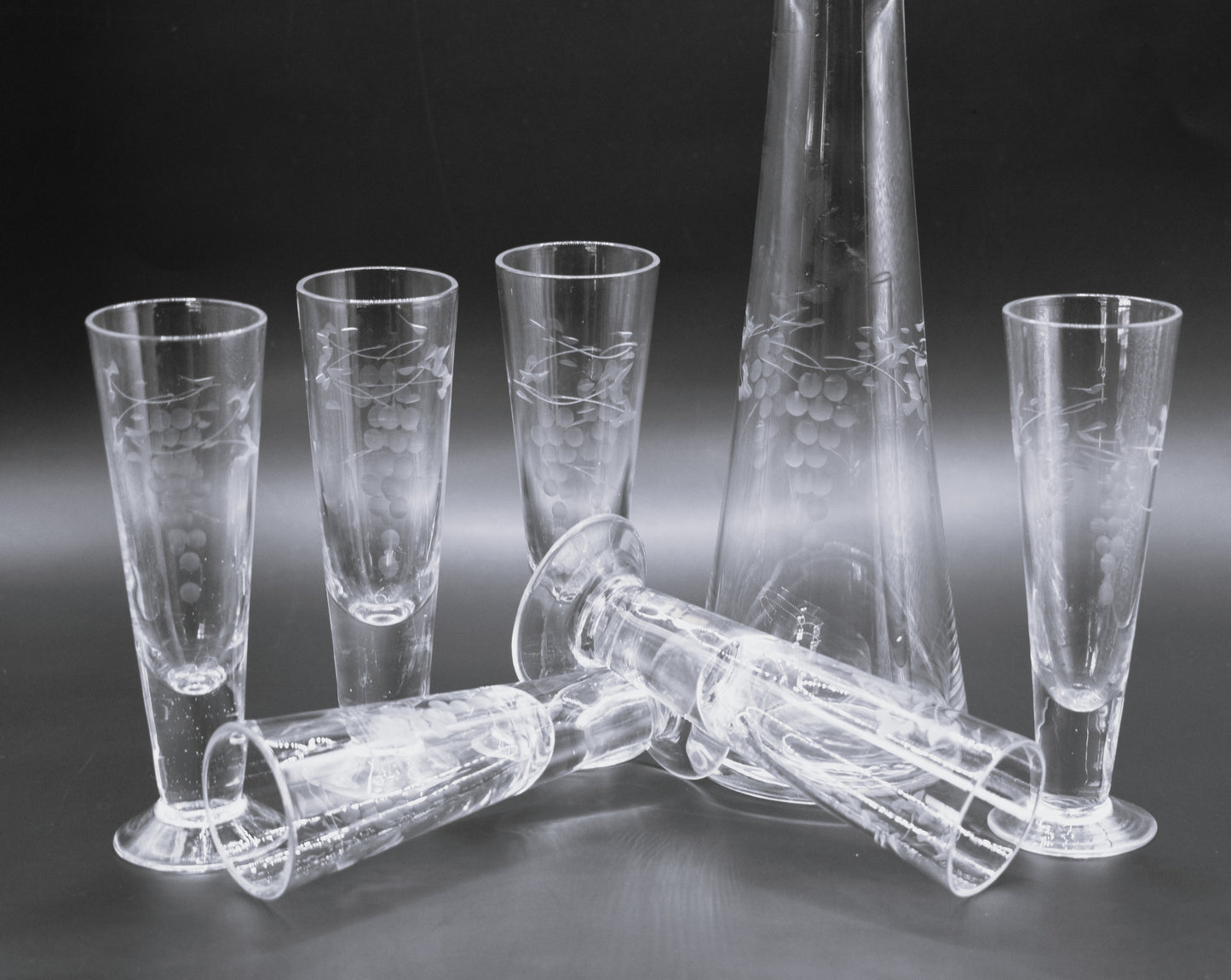 Vintage etched Grape mofit Blown Glass Decanter w/stopper and 6 footed shot glasses.