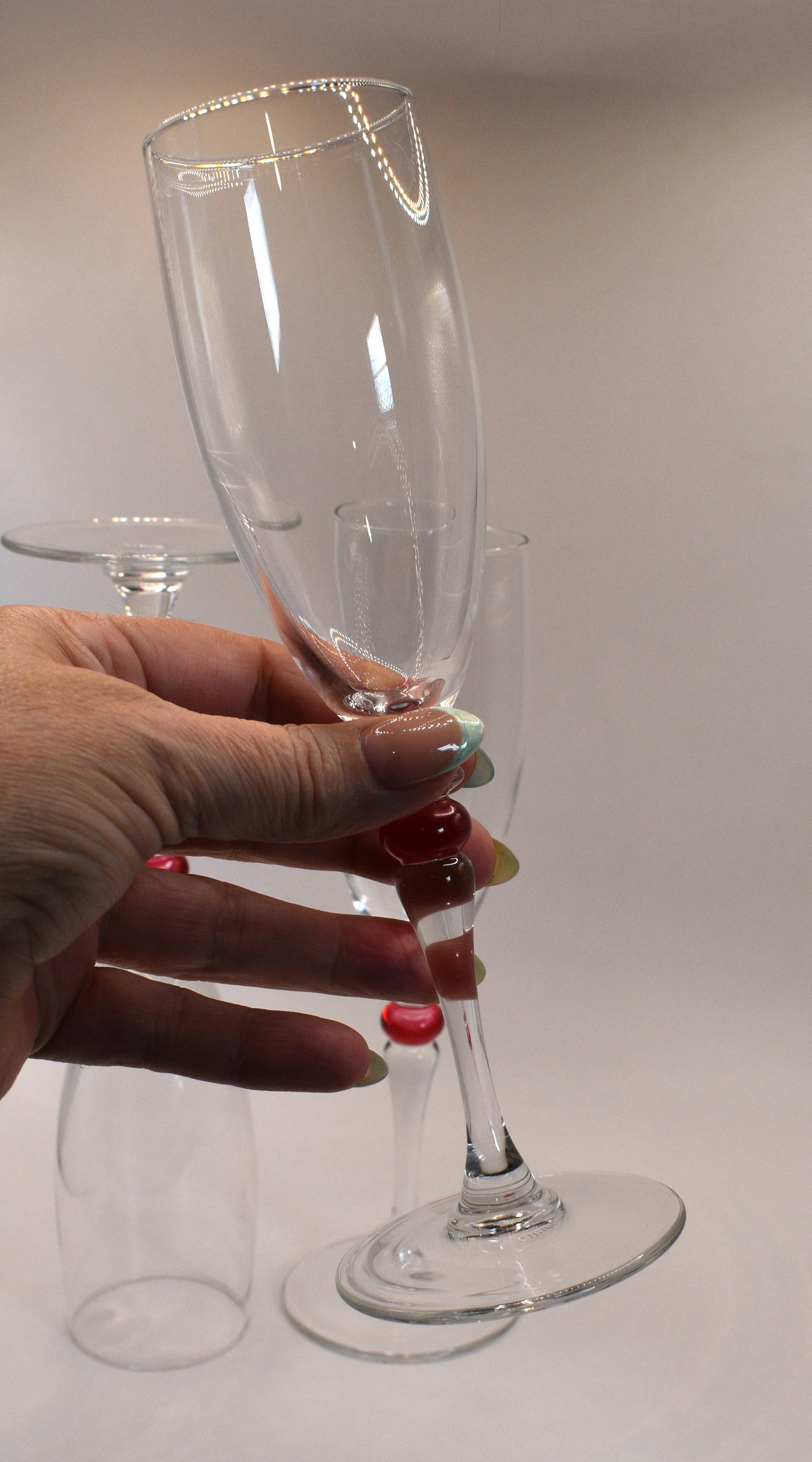 Cortina Red by Cristal D'Arques-Duraid. Champagne Flute with red wafer stem. Set of 3