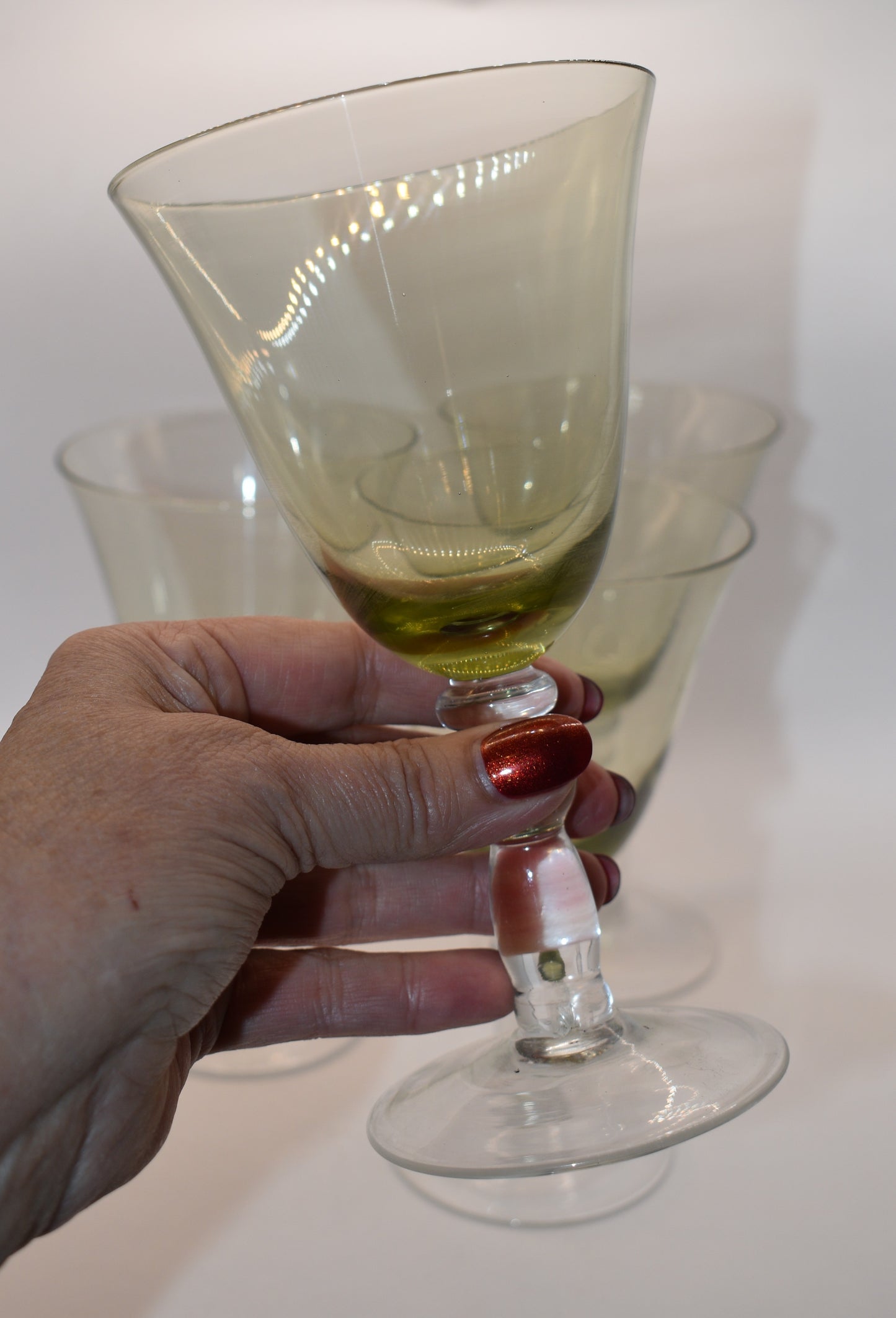 Green Glass Goblets with clear ball stems. Set of 4