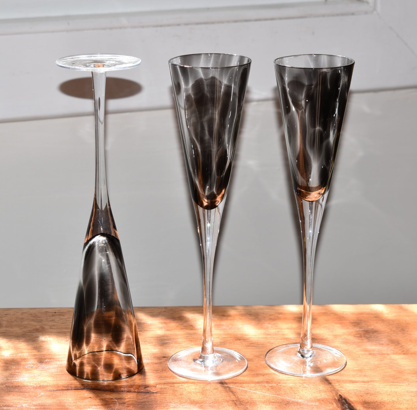Tall stemmed trumpet styled Champagne Flutes with Black mottled glass. Set of 3