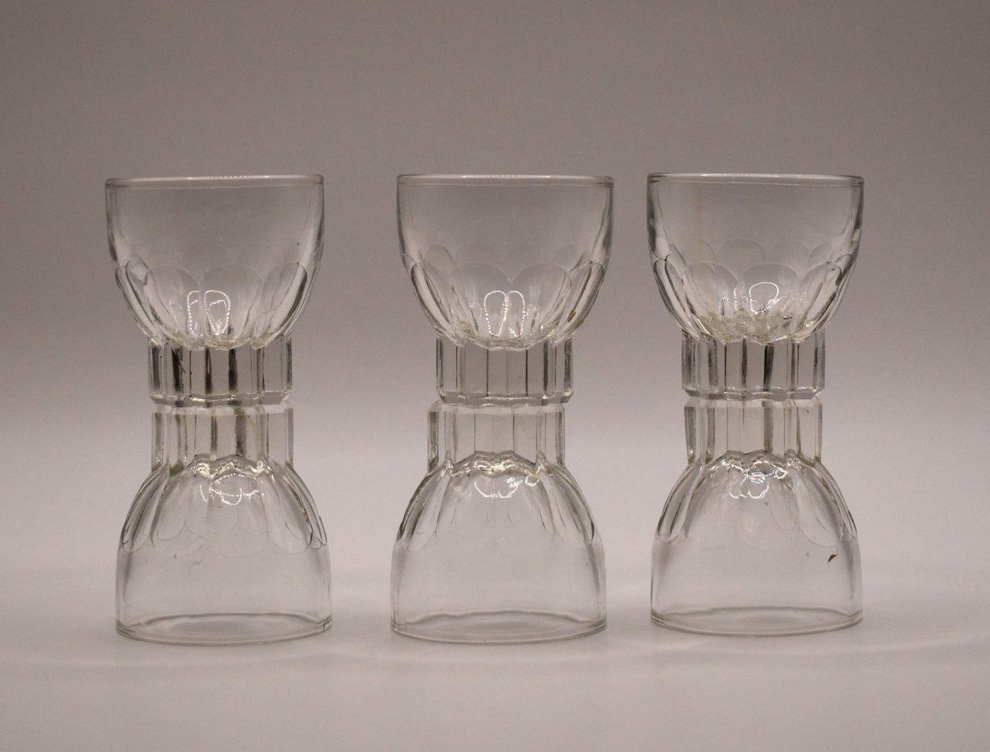 MCM clear glass shot glasses. Set of 6