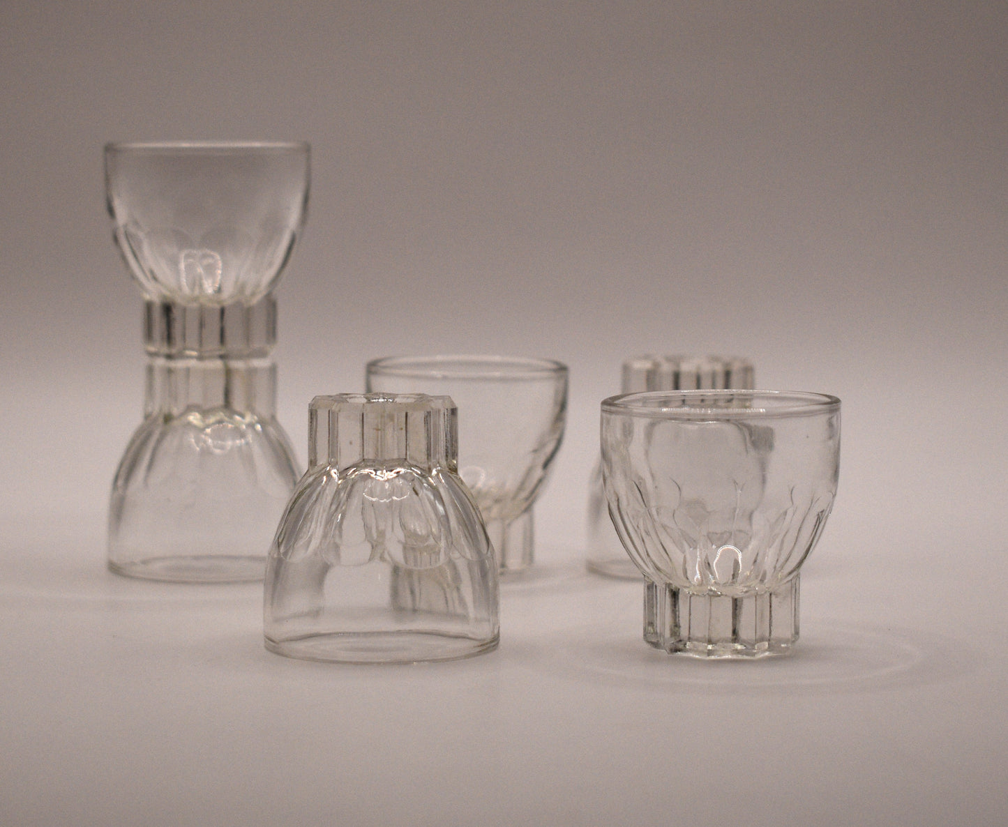 MCM clear glass shot glasses. Set of 6