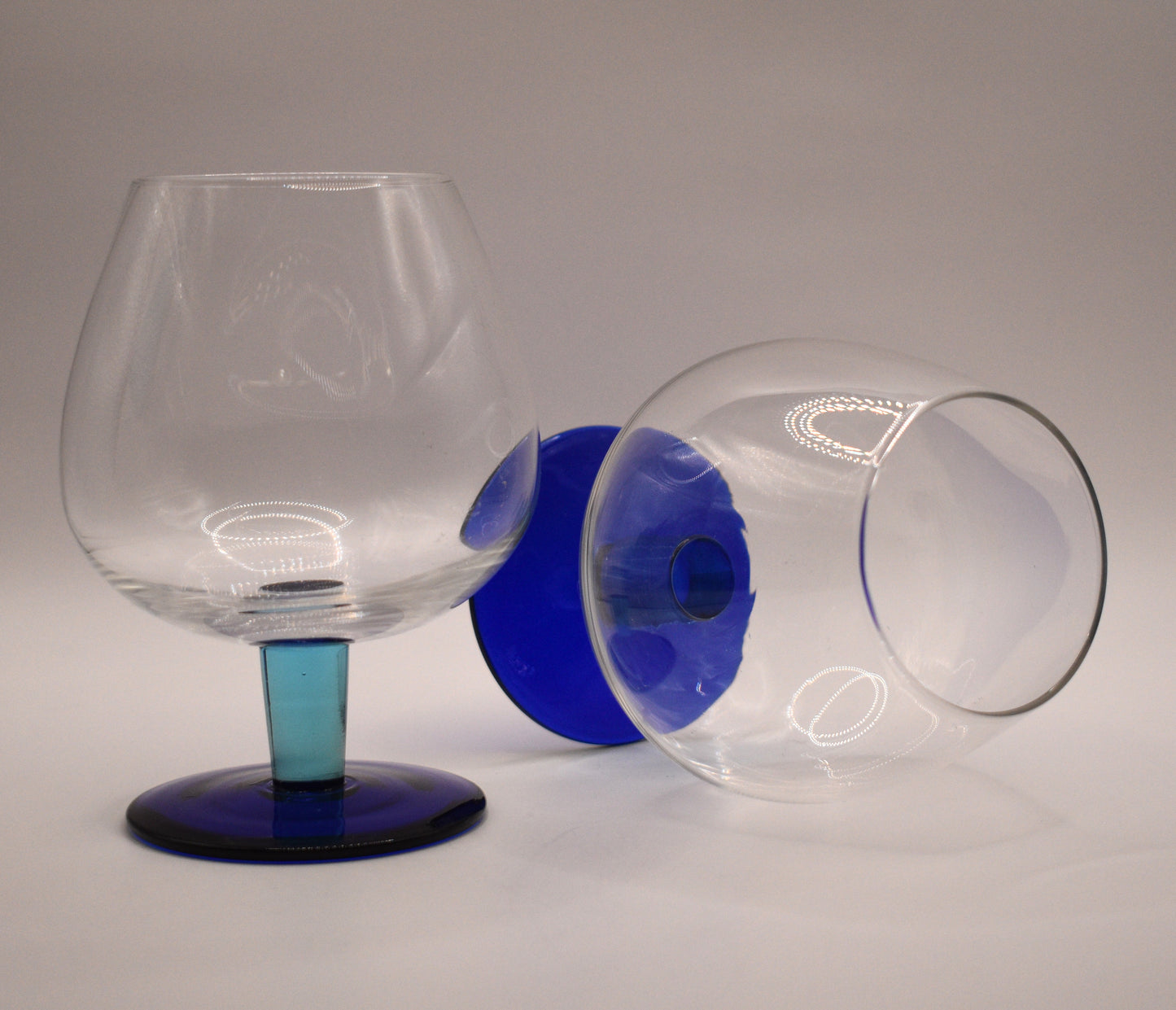 Fabulous set of 2 light blue stem with dark blue footed Brandy/Cocktail Glasses. Set of 2