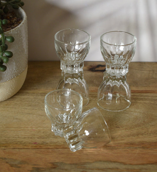 MCM clear glass shot glasses. Set of 6