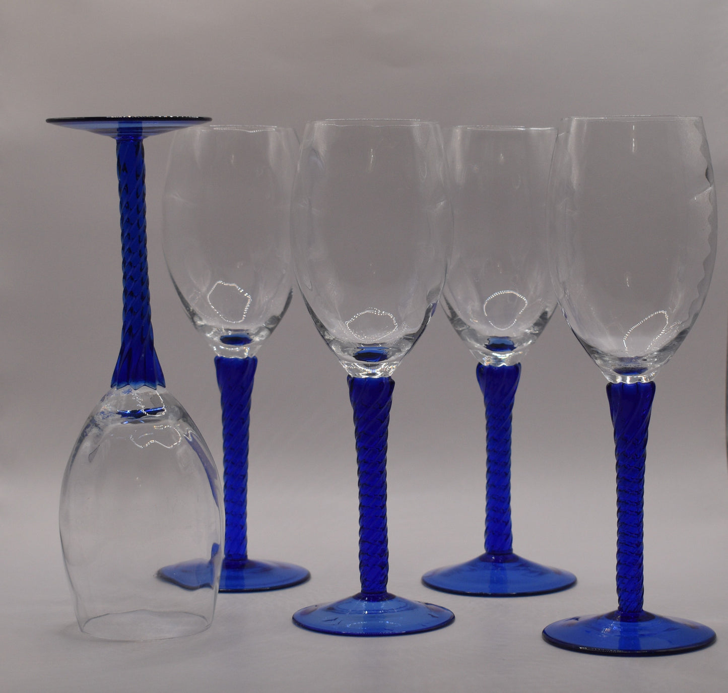 Vintage Blue Wine Glasses. Set of 5. Blue twisted stem and optical swirl bowl.