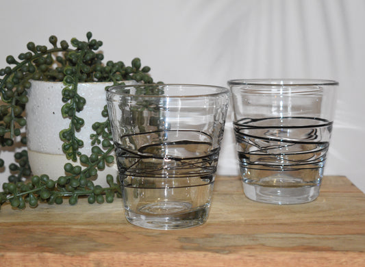 Uzu Clear and black fused handblown lowball glasses. Set of 2