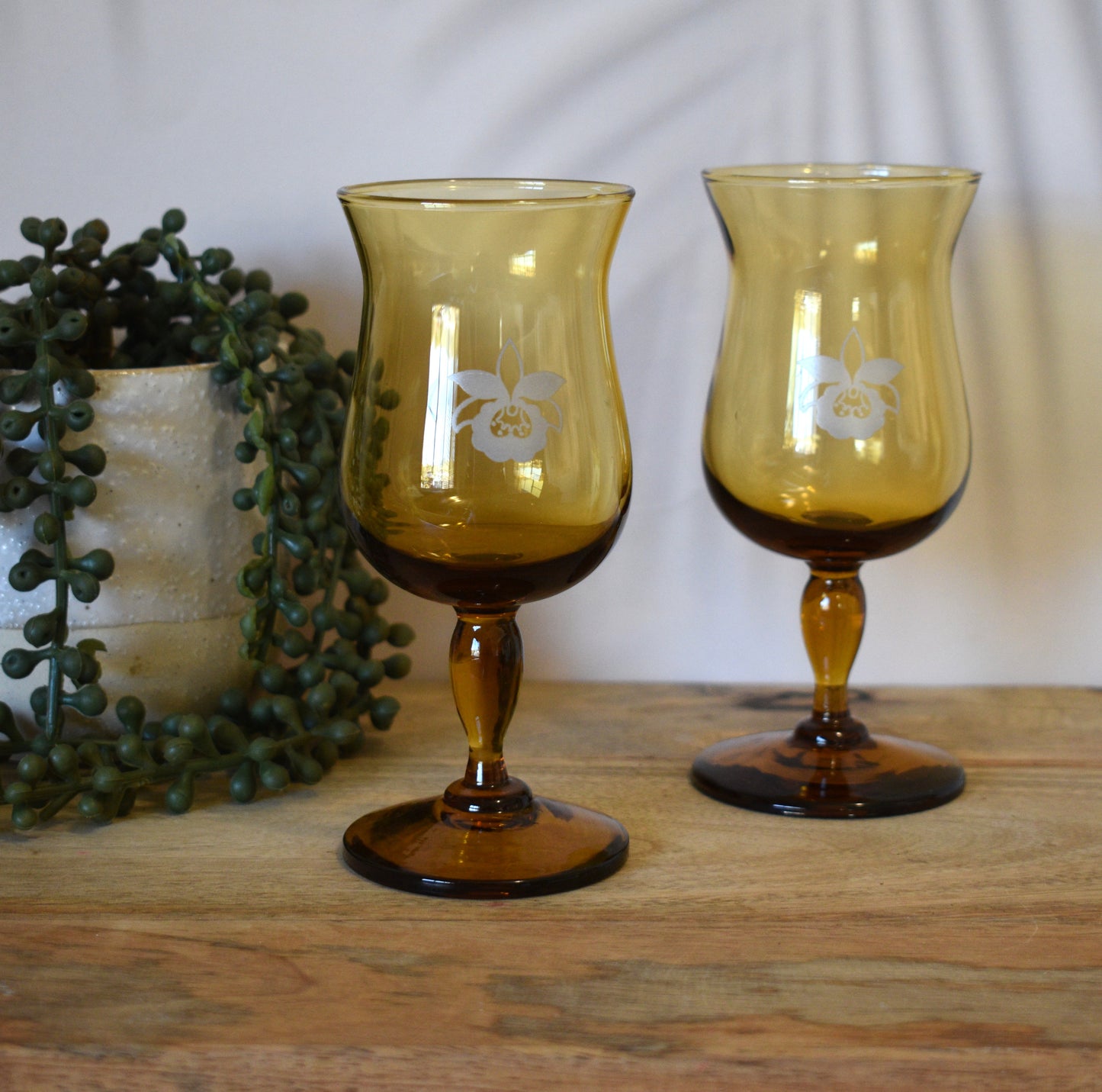 Amber wine goblets with embosed orchid design. Set of 2