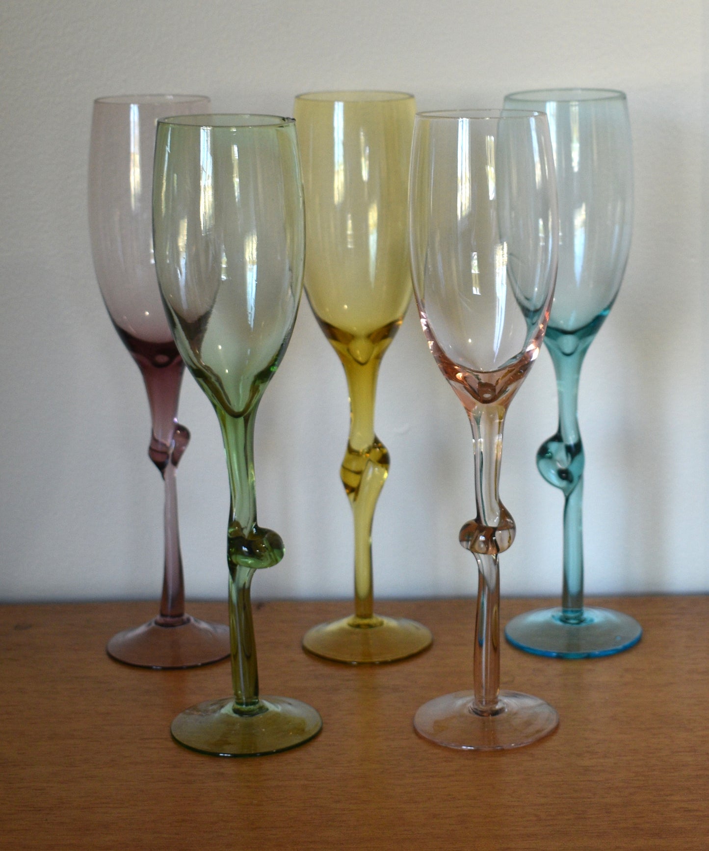 Set of 5 Harlequin coloured Champagne flutes with knotted stems