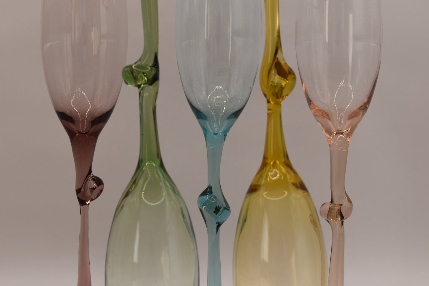 Set of 5 Harlequin coloured Champagne flutes with knotted stems