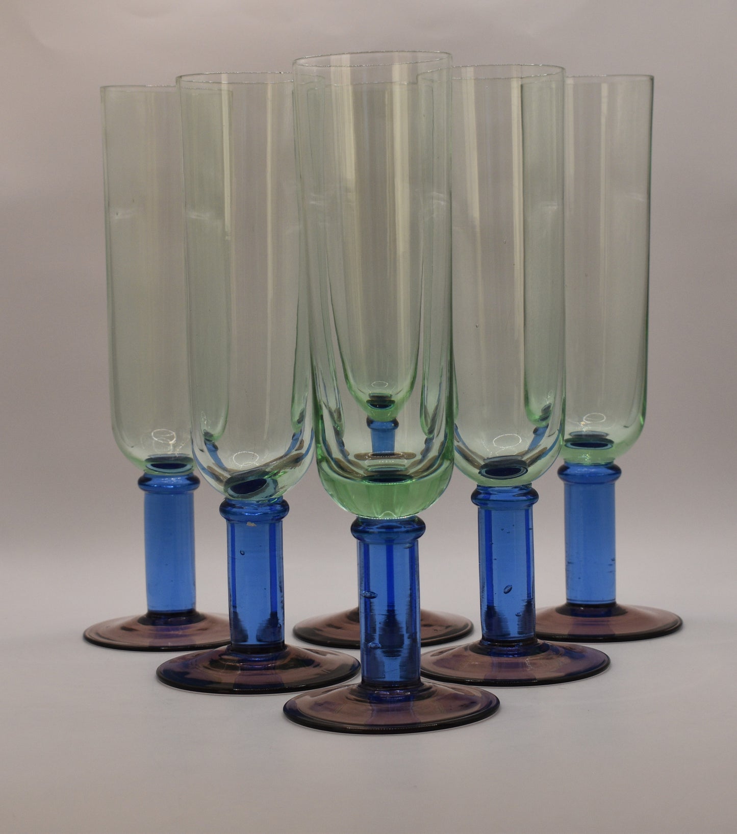 Green glass Champagne Flutes with blue stem and purple foot. Handblown. Set of 5