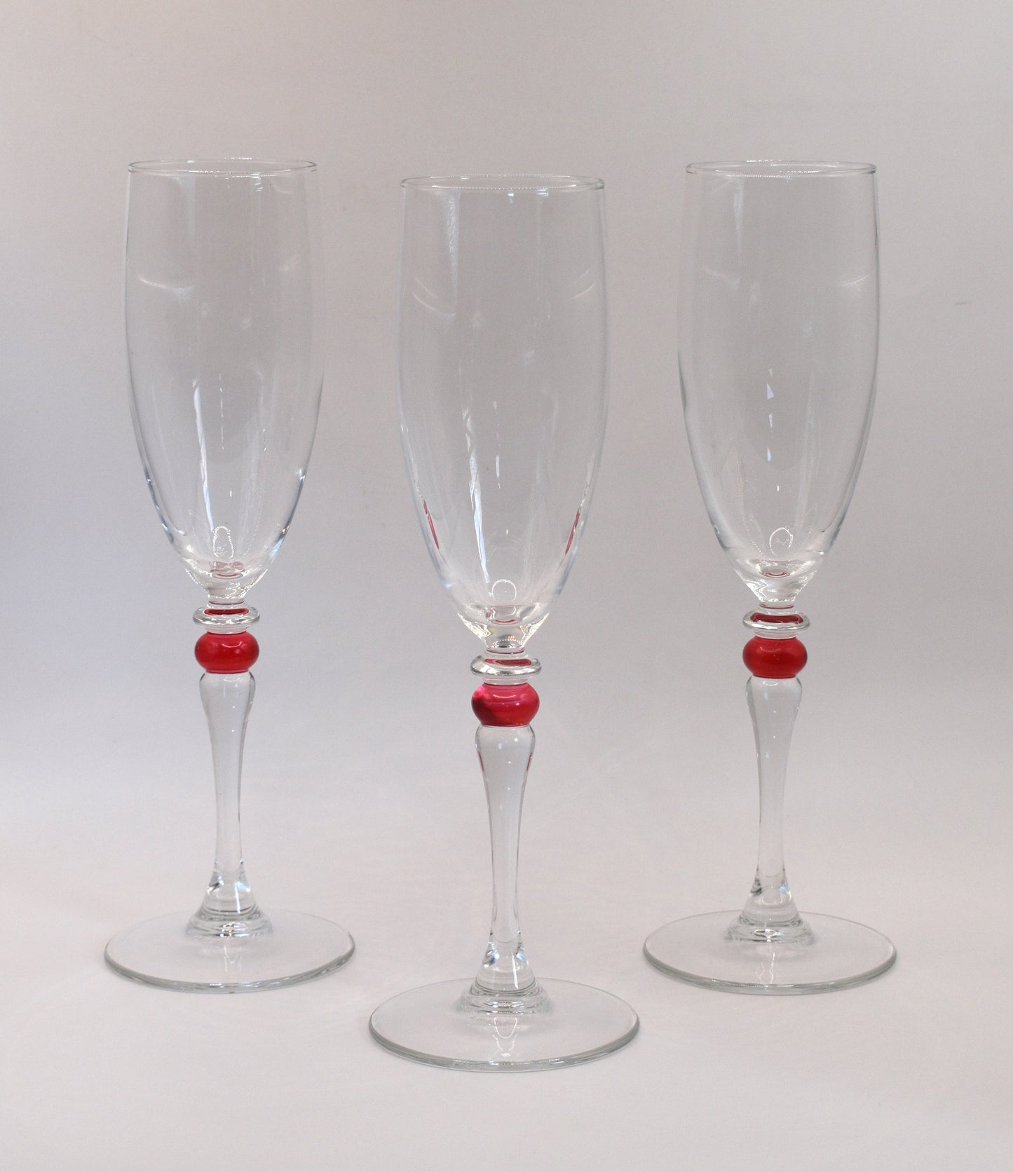 Cortina Red by Cristal D'Arques-Duraid. Champagne Flute with red wafer stem. Set of 3