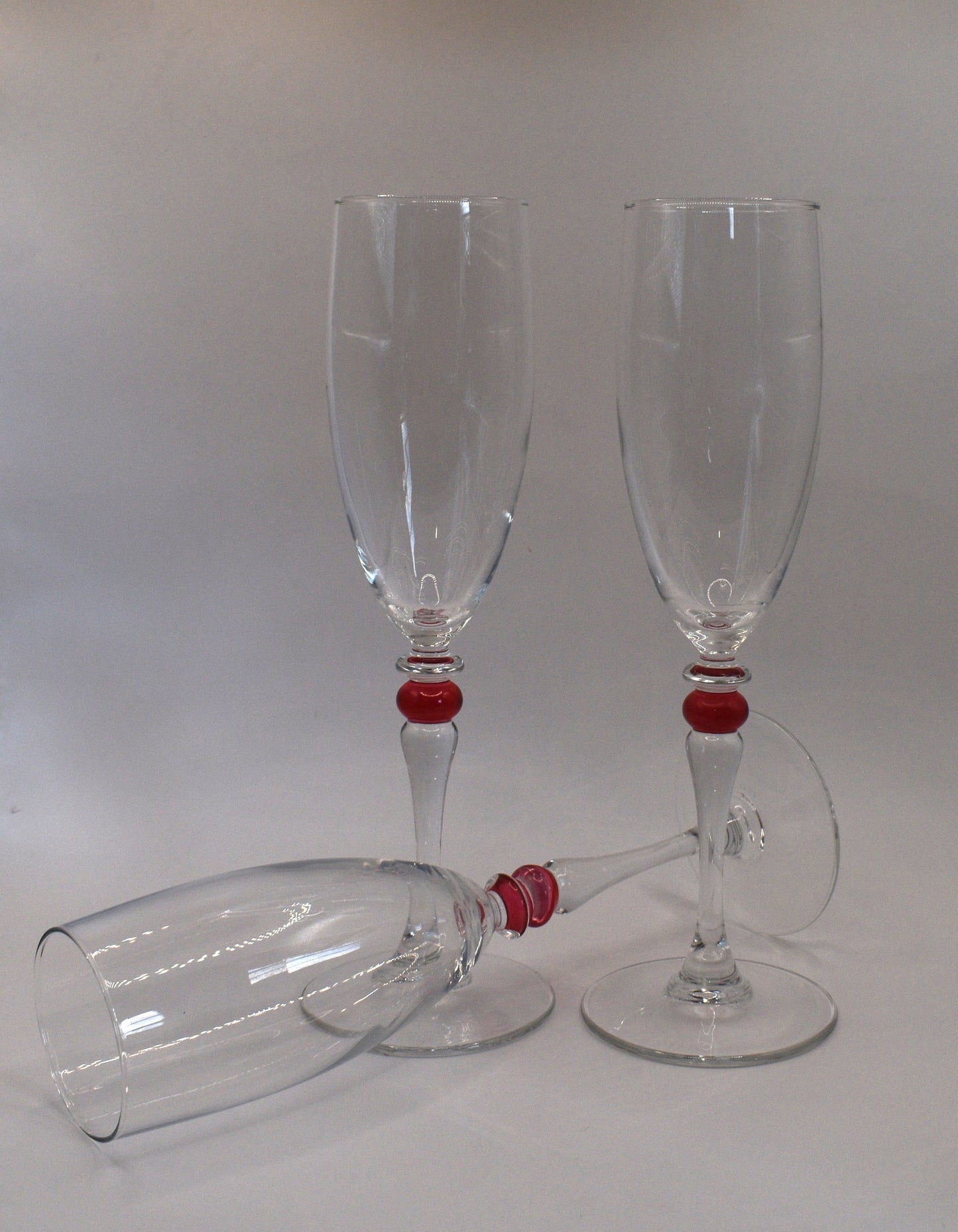 Cortina Red by Cristal D'Arques-Duraid. Champagne Flute with red wafer stem. Set of 3