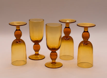 MCM Amber Decanter with 5 stemed liqueur glasses.