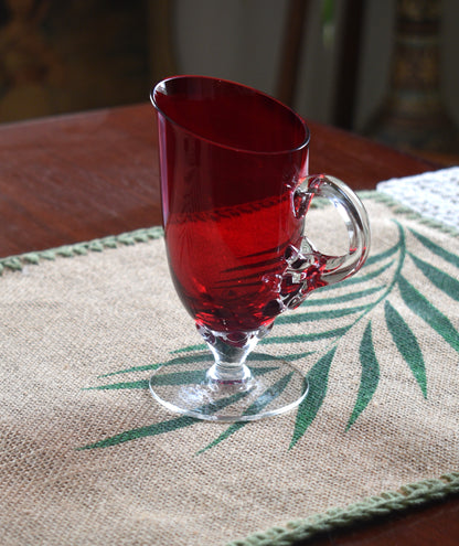 Vintage Ruby Red jug with clear claw stem and handle.