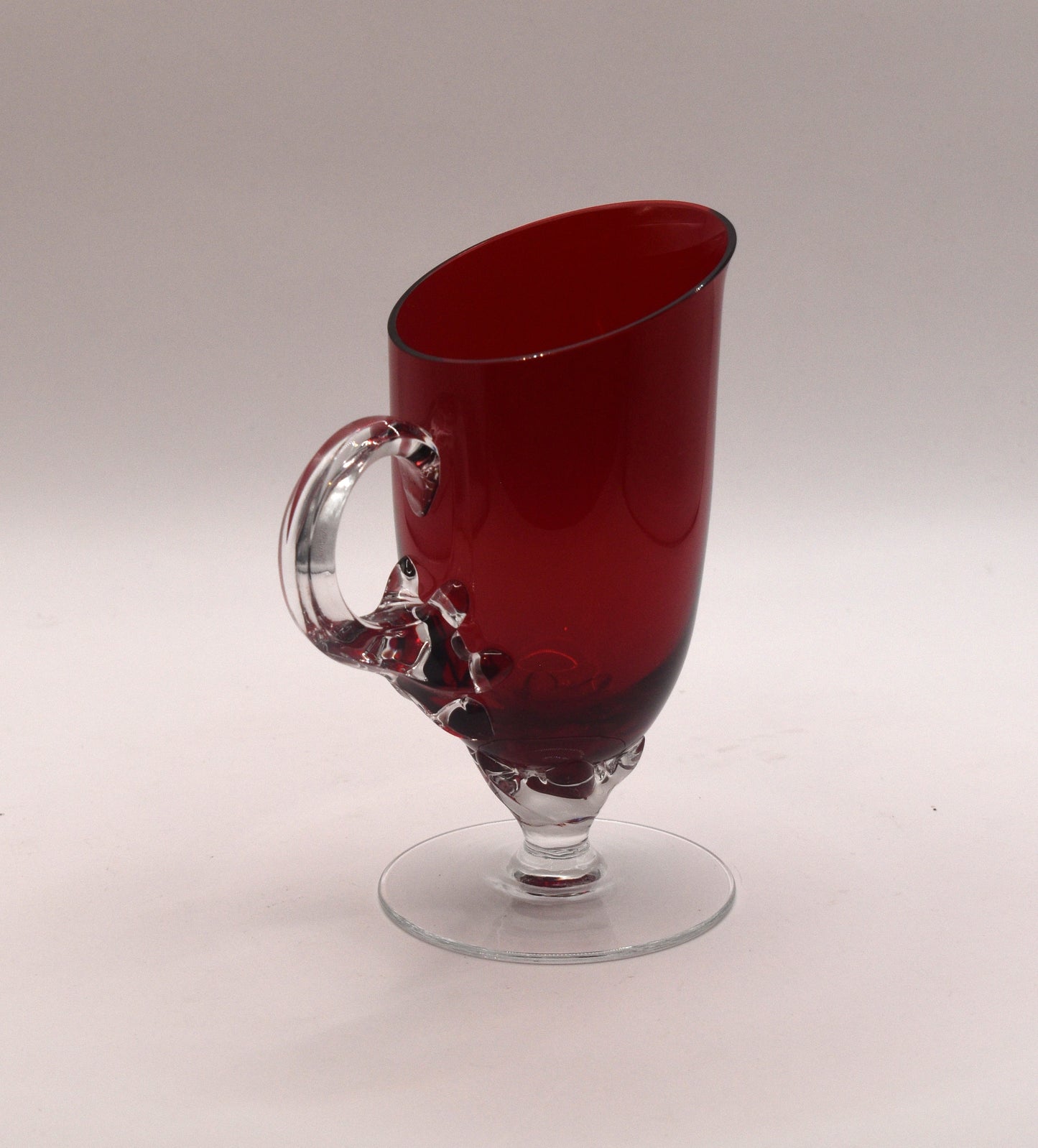 Vintage Ruby Red jug with clear claw stem and handle.