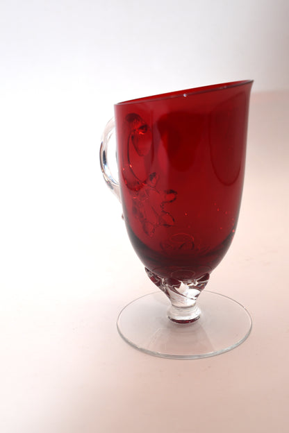 Vintage Ruby Red jug with clear claw stem and handle.