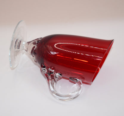 Vintage Ruby Red jug with clear claw stem and handle.