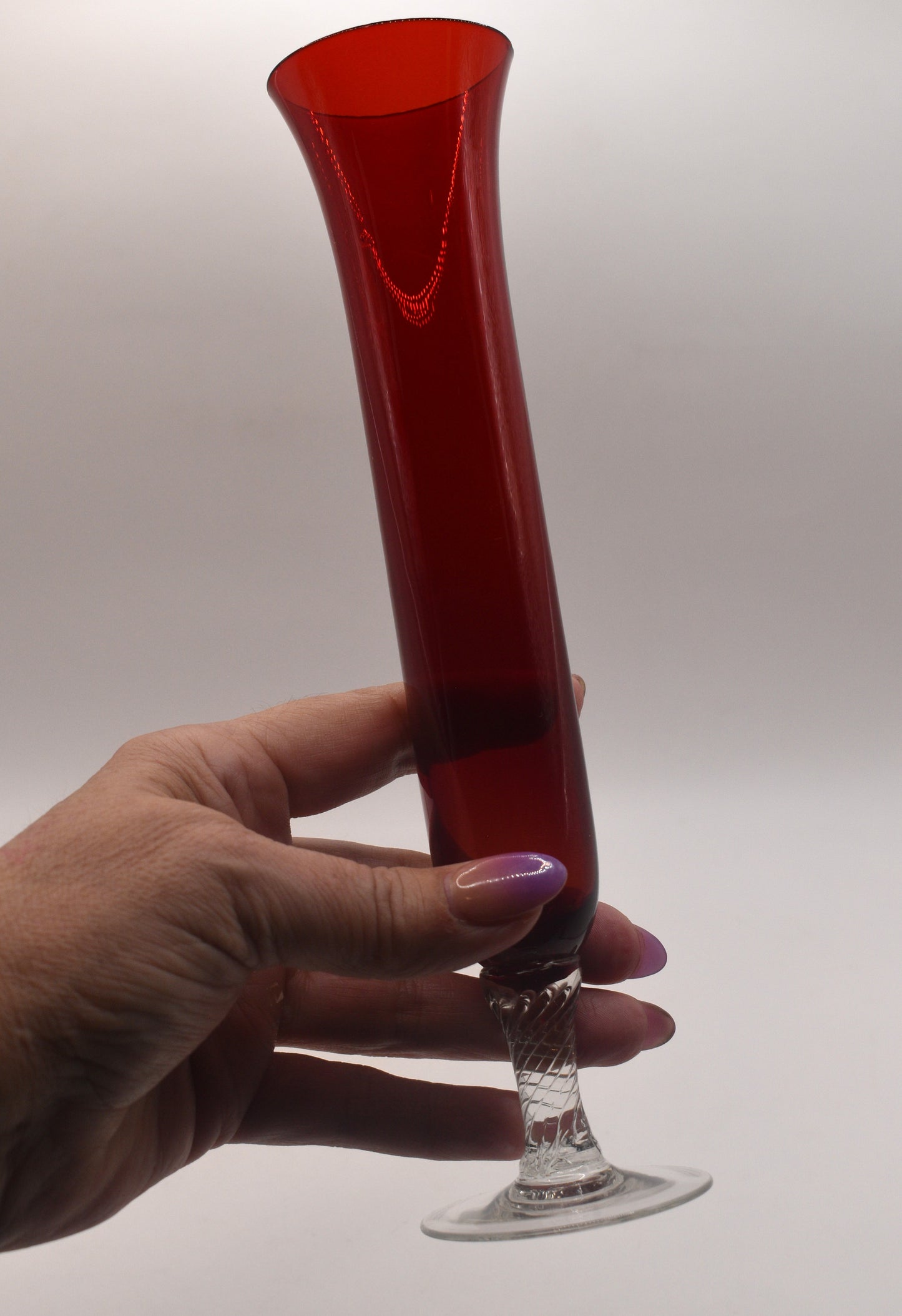 Vintage ruby red long stemmed bud vase.