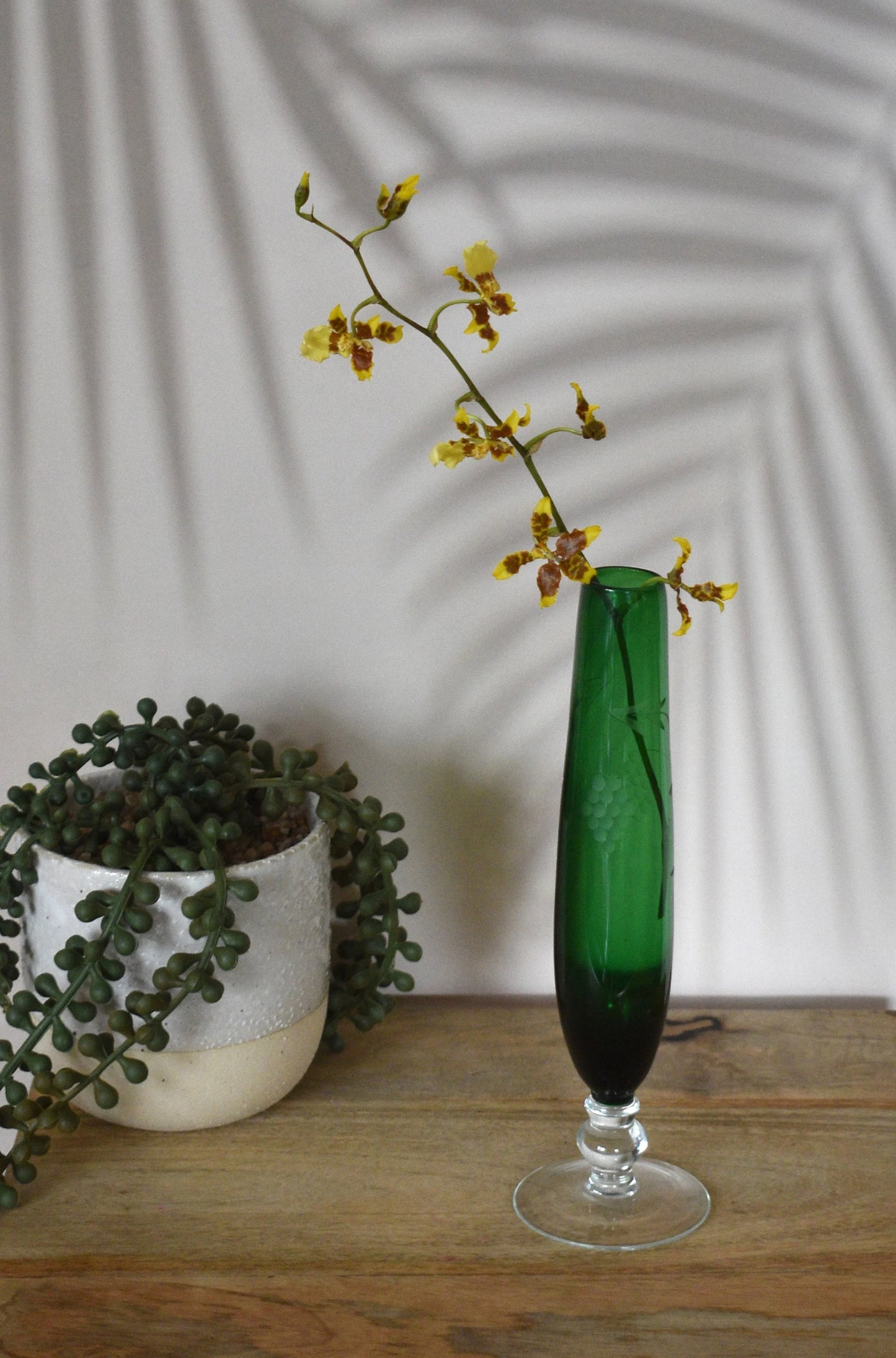 Vintage Emerald Green footed bud vase with etched design.