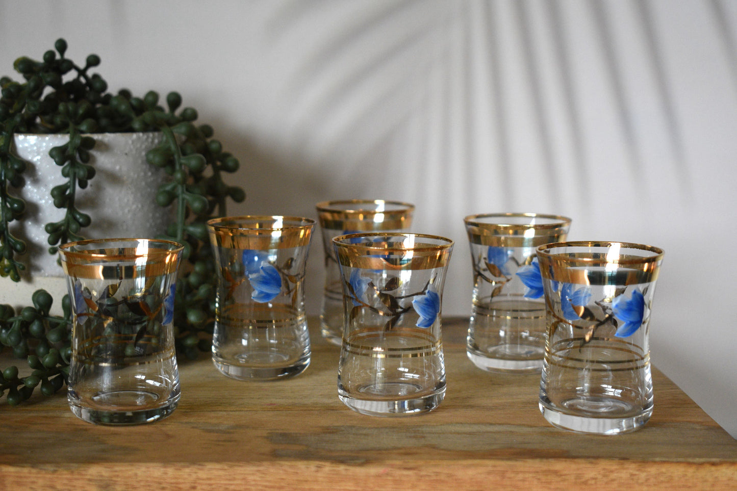 Vintage stemless shot glasses with hand painted blue flower design with leaves and gold trimmings. Sherry Glasses. Port Glasses. Set of 6