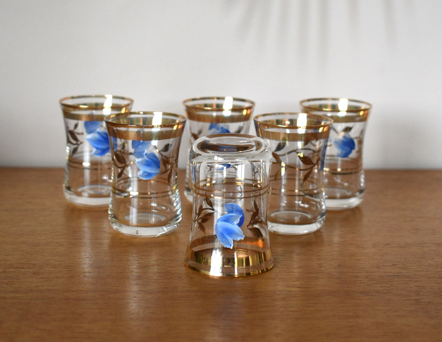 Vintage stemless shot glasses with hand painted blue flower design with leaves and gold trimmings. Sherry Glasses. Port Glasses. Set of 6