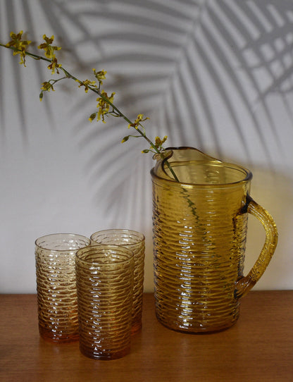 Vintage Anchor Hocking Soreno Gold Amber Glass Pitcher and 3 glass tumblers.